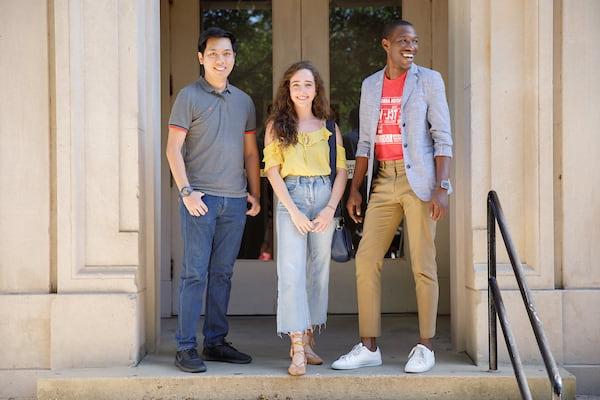 Students stand together at the entry of B.B. Comer Hall.